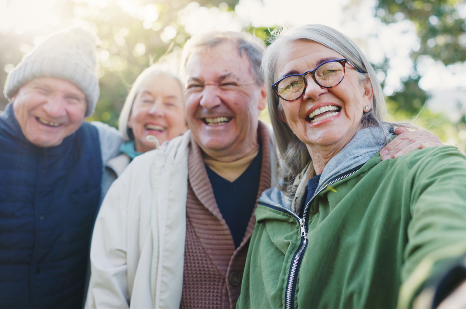 A happy group of older adults taking a selfie.