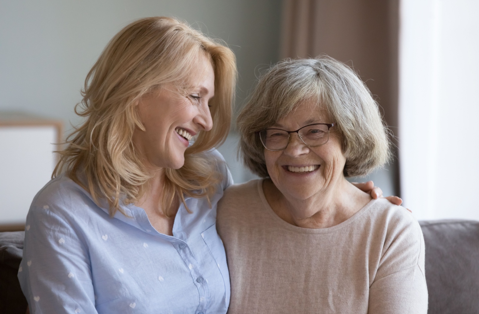 An adult child has a pleasant and productive chat with their senior parent about the possibility of assisted living.
